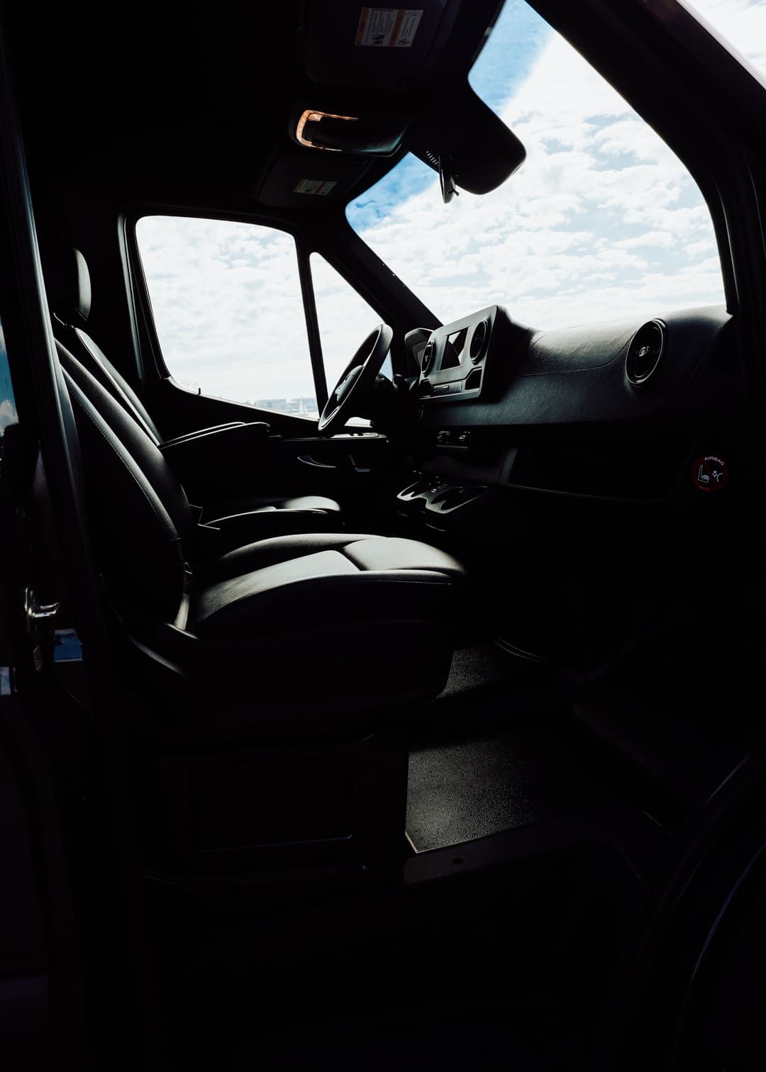 Front passenger entry area of San Diego sprinter van rental