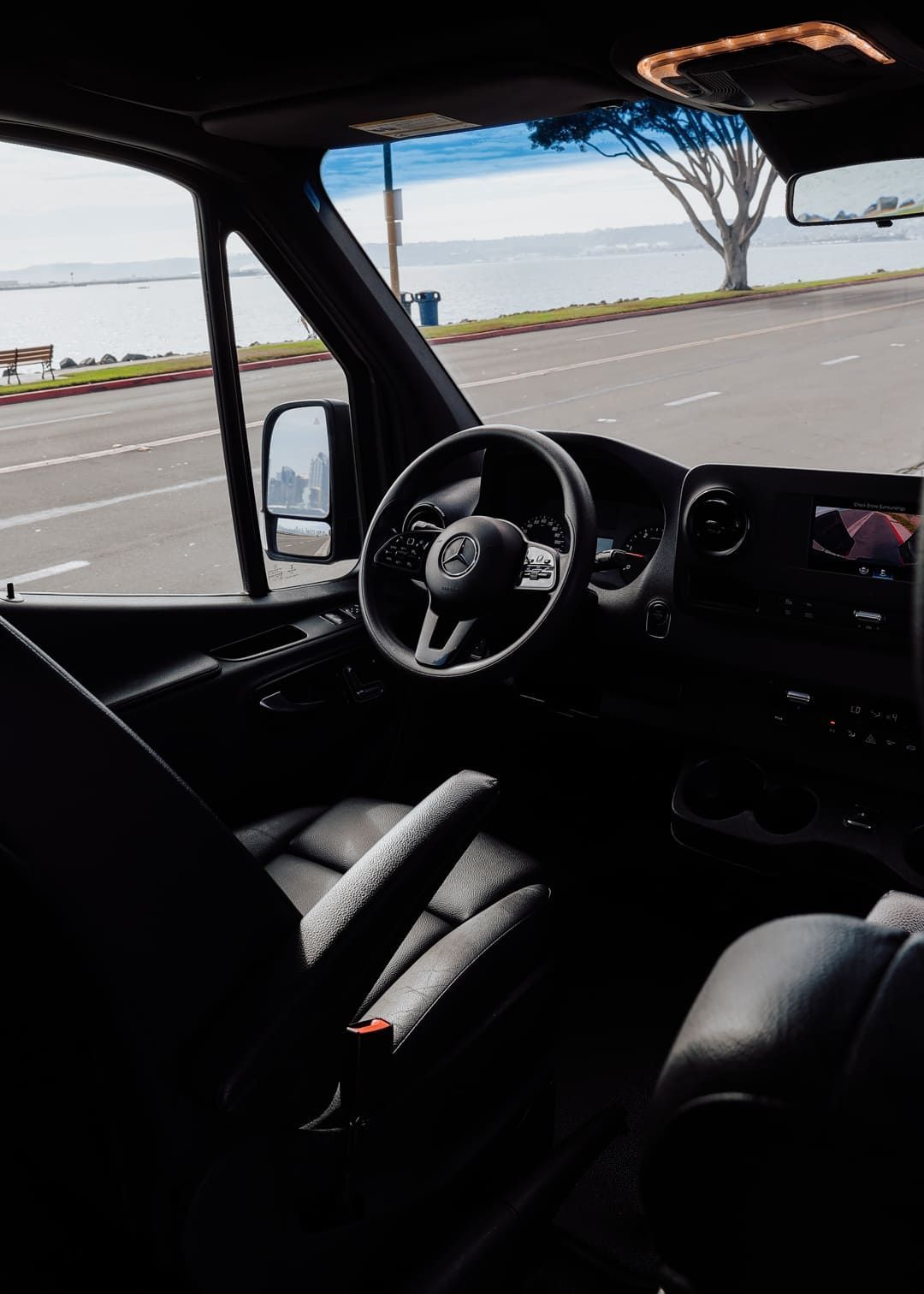 Driver seat view inside sprinter van rental in San Diego