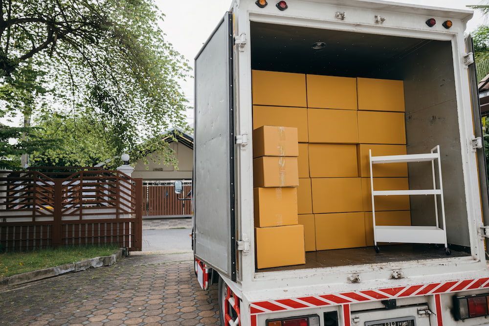 A Moving Truck is Filled With Boxes and a Shelf — Express Couriers Mackay in Paget, QLD