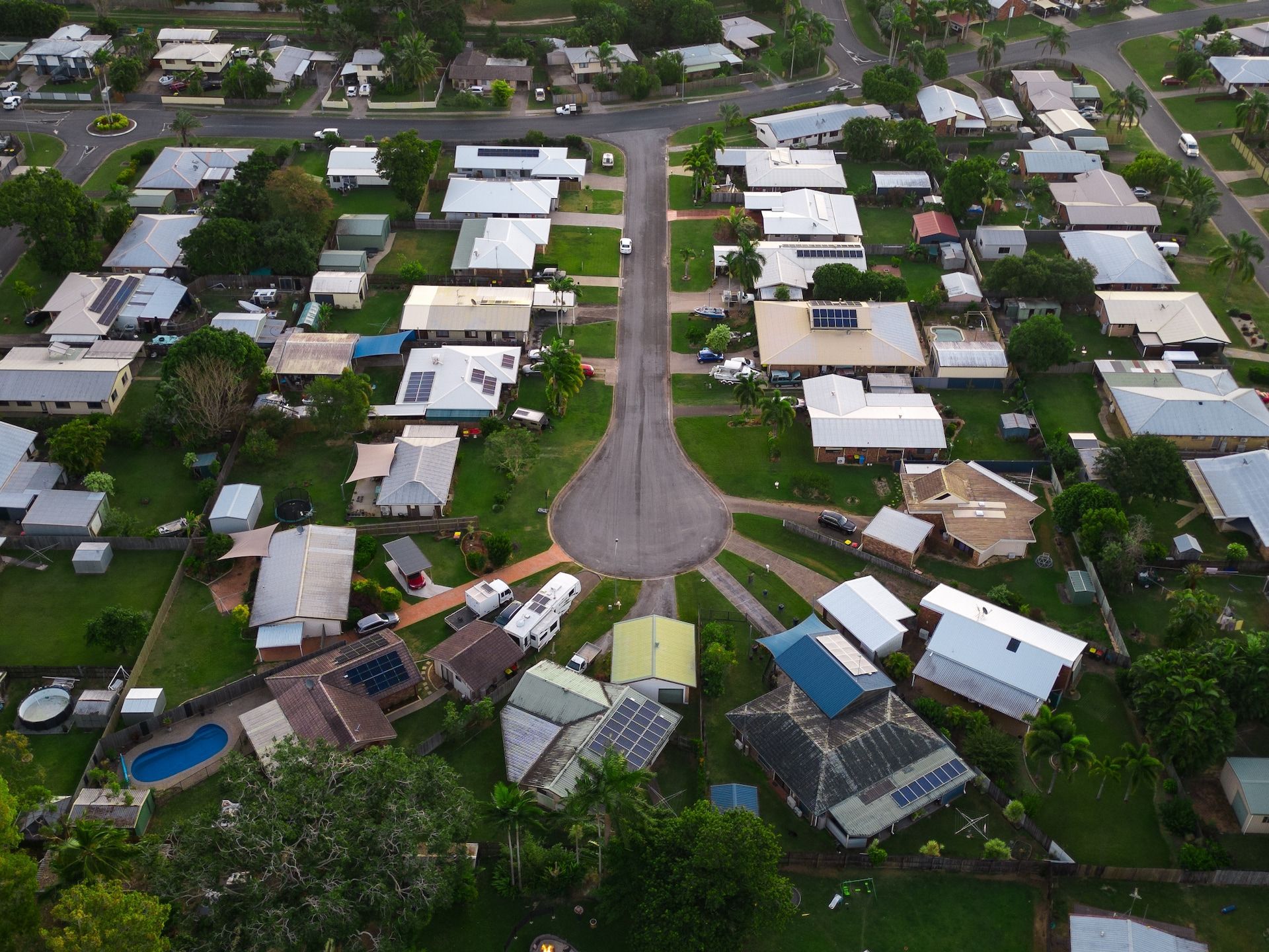 An Aerial View of a Residential Area With Lots of Houses and Trees — Express Couriers Mackay in Paget, QLD