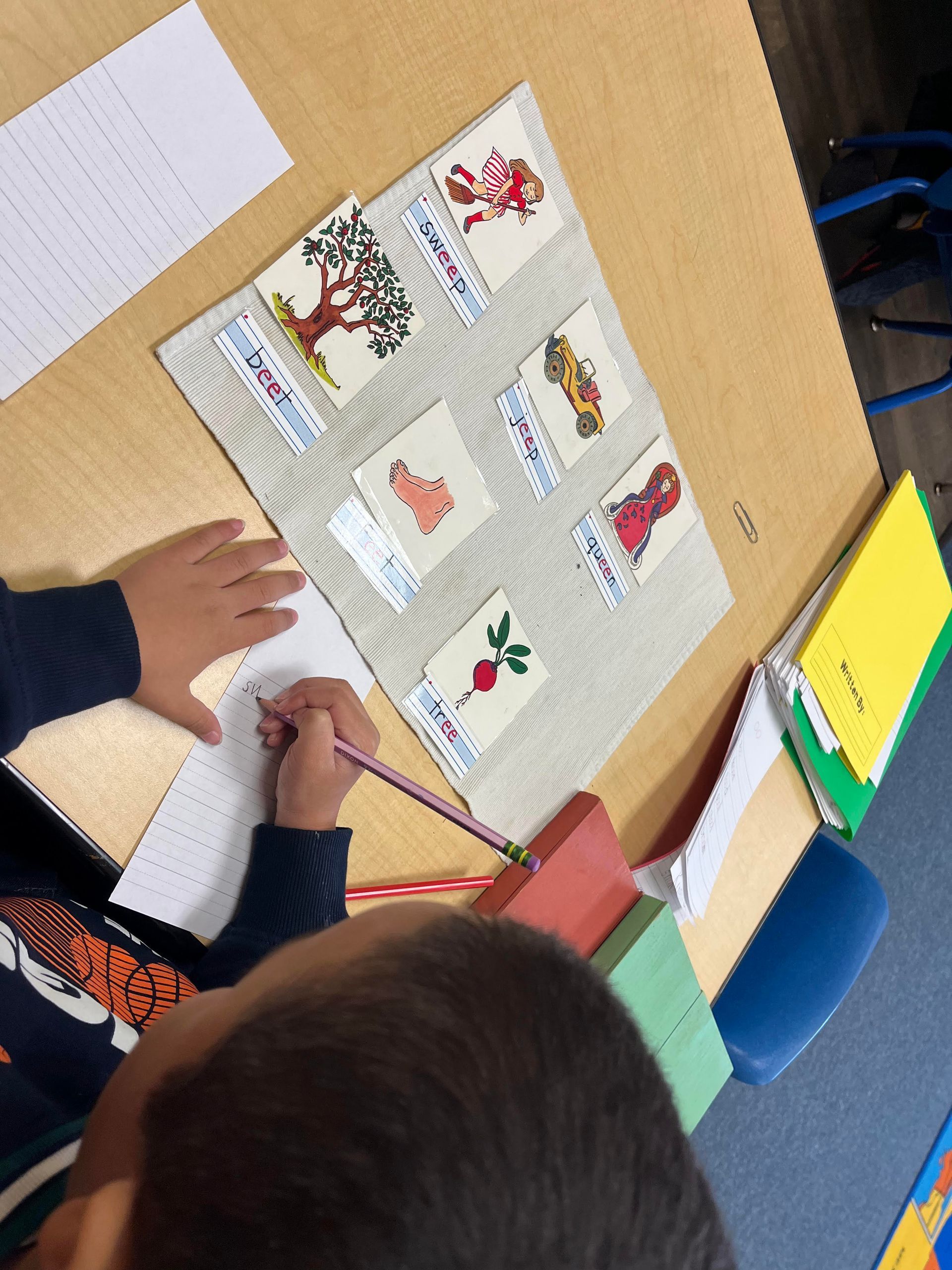 Montessori child working with language materials