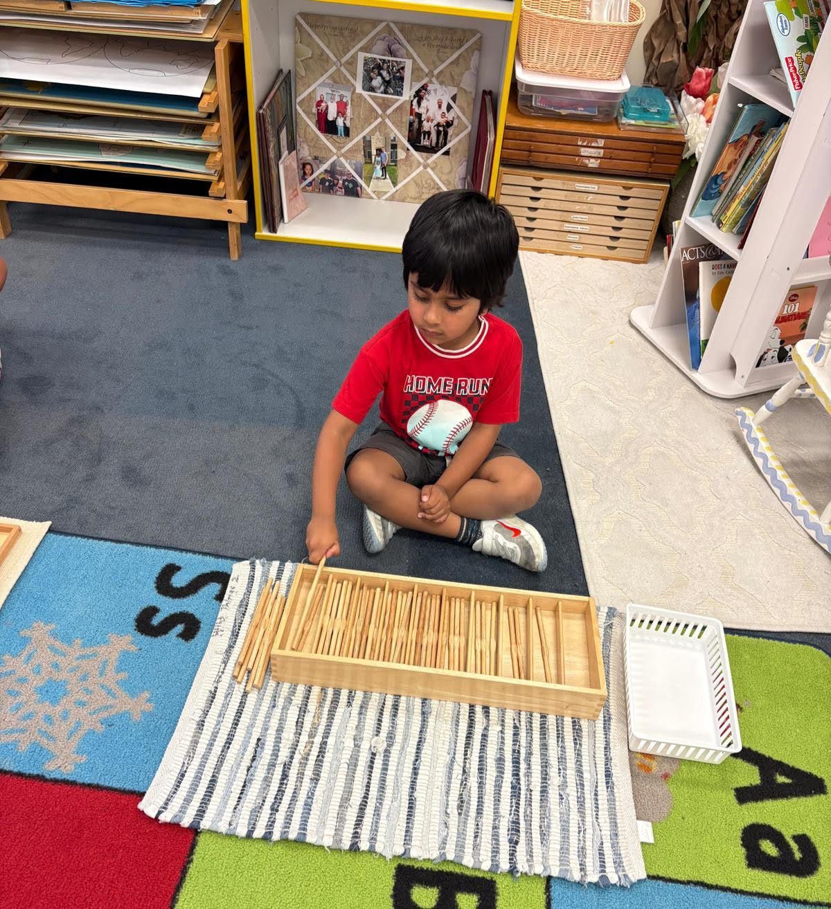 Montessori child working with math spindle box