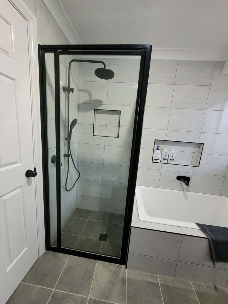 Shower Glass Cubicle Beside A Bathtub — Shower Screens in Dubbo, NSW