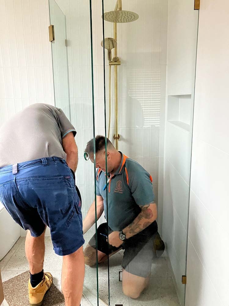Two Man Installing Glass Screen — Shower Screens in Dubbo, NSW