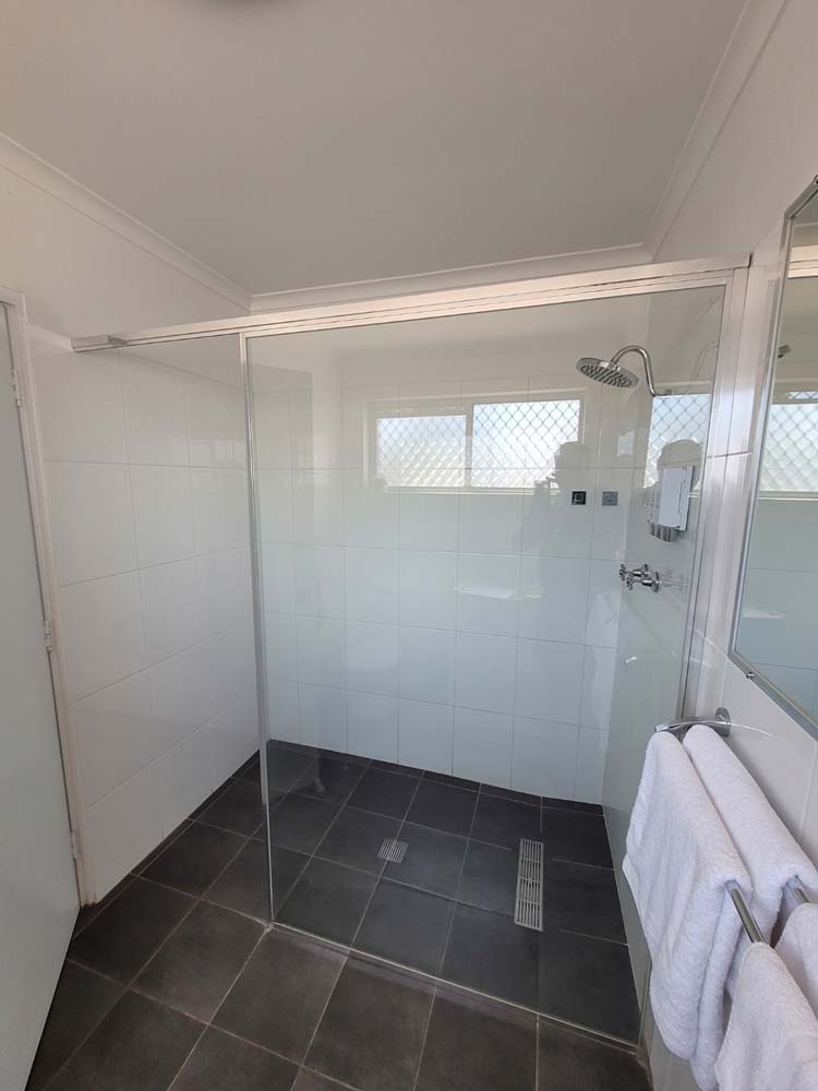 Shower With Glass Screen and Towels — Shower Screens in Dubbo, NSW