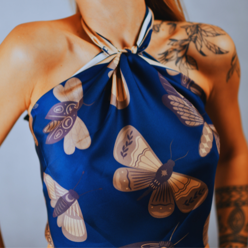 A model wearing a silk scarf as a top