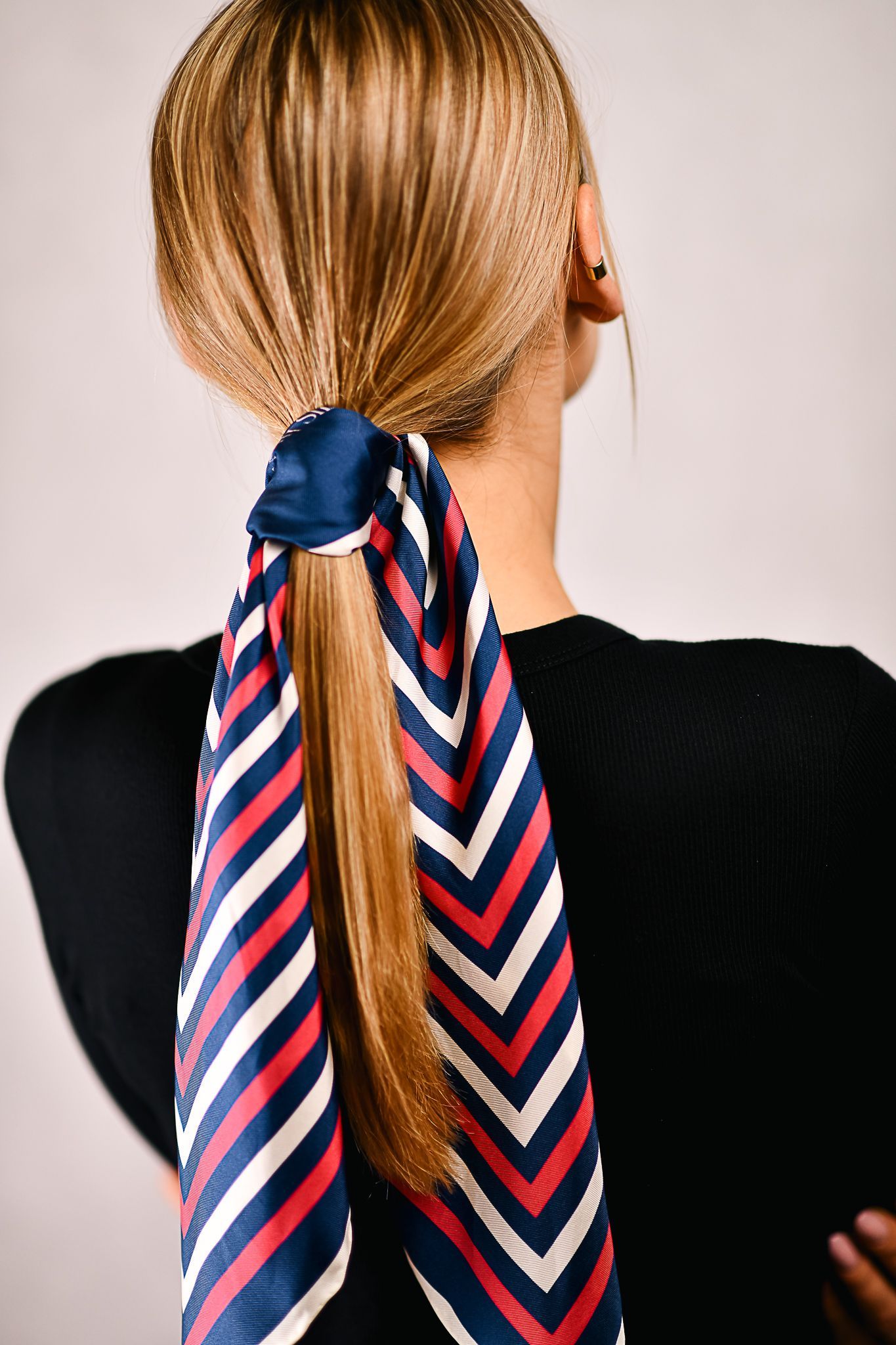 A silk scarf tied around hair, silk hair scarf, red and blue classic design silk scarf