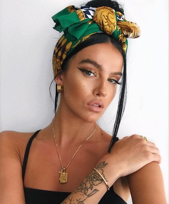 A celebrity wearing a womens silk scarf