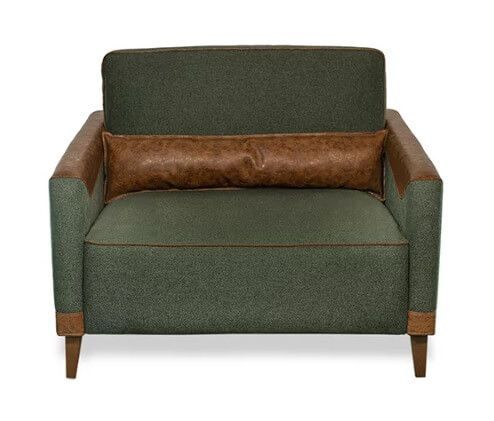 Poltrona clássica verde com detalhes em couro legítimo, vista anterior, design de alto padrão, personalizável conforme o ambiente e com entrega disponível em todo o Brasil. Ideal para quem busca exclusividade e sofisticação em móveis de luxo.
