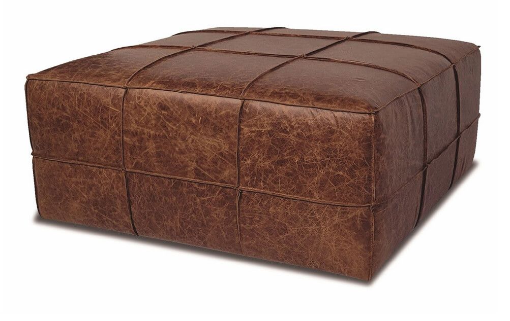 Puff baú de couro legítimo de alto padrão, com design contemporâneo e acabamento sofisticado. Estrutura robusta, compartimento interno para armazenamento e estofamento confortável.