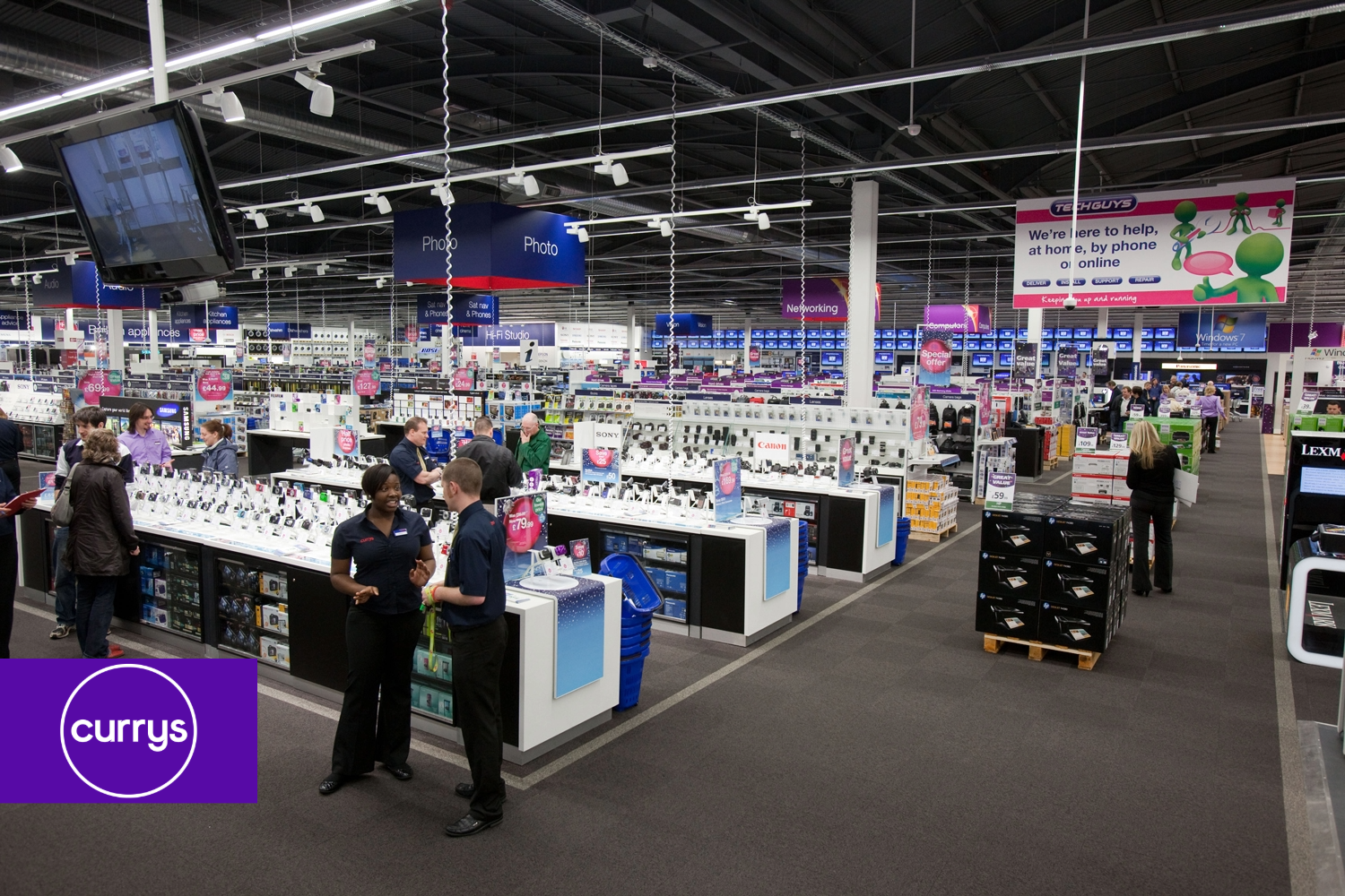 A group of people are standing in a store called cury 's
