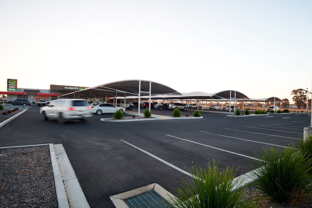 Parking Lot With Cars, Covered By Canopies. Building In Background — Quarrell Civil Construction In Yarrawonga, VIC