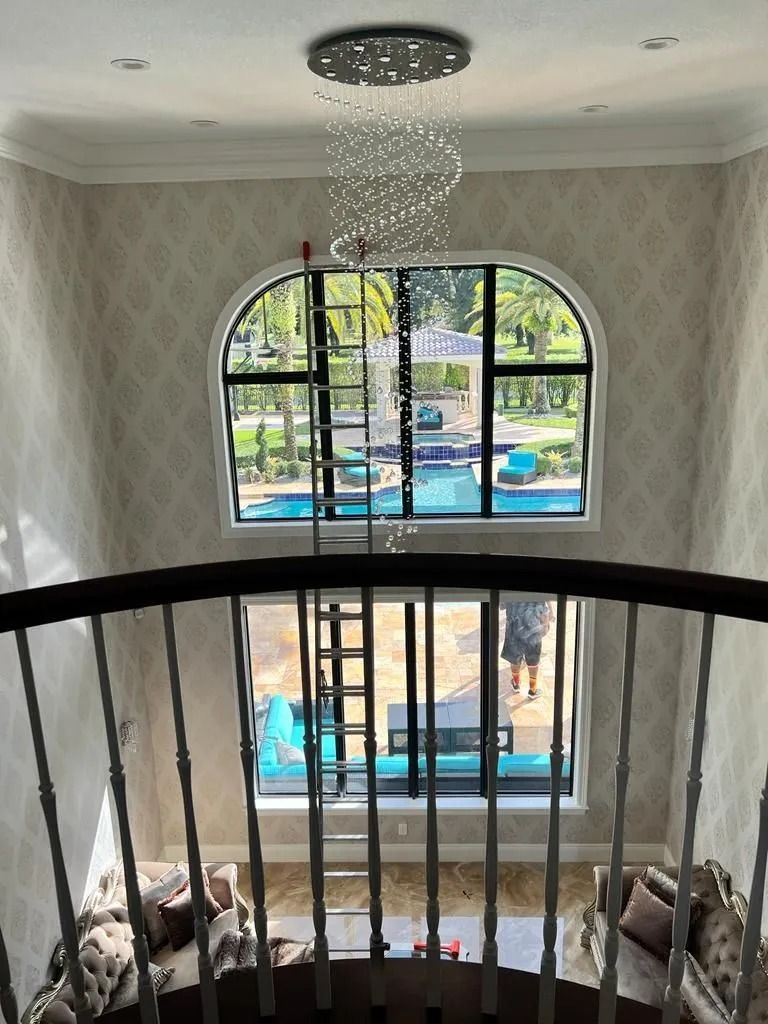 A view of a living room from the second floor of a house.
