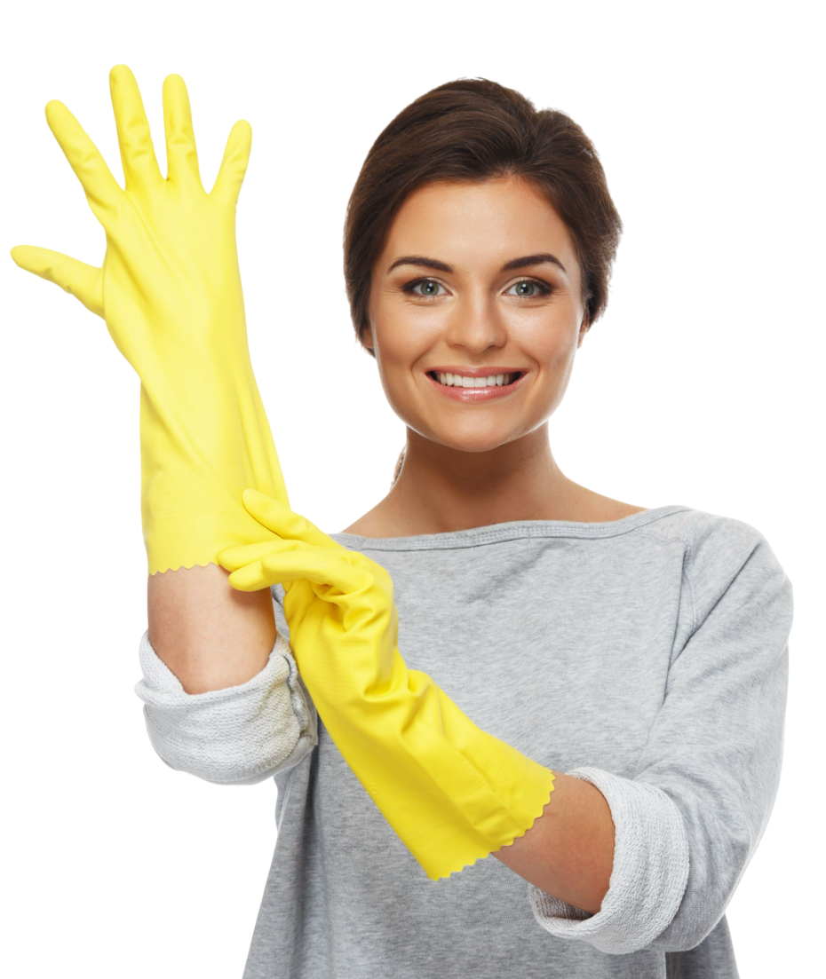 Woman putting on yellow cleaning gloves, smiling.