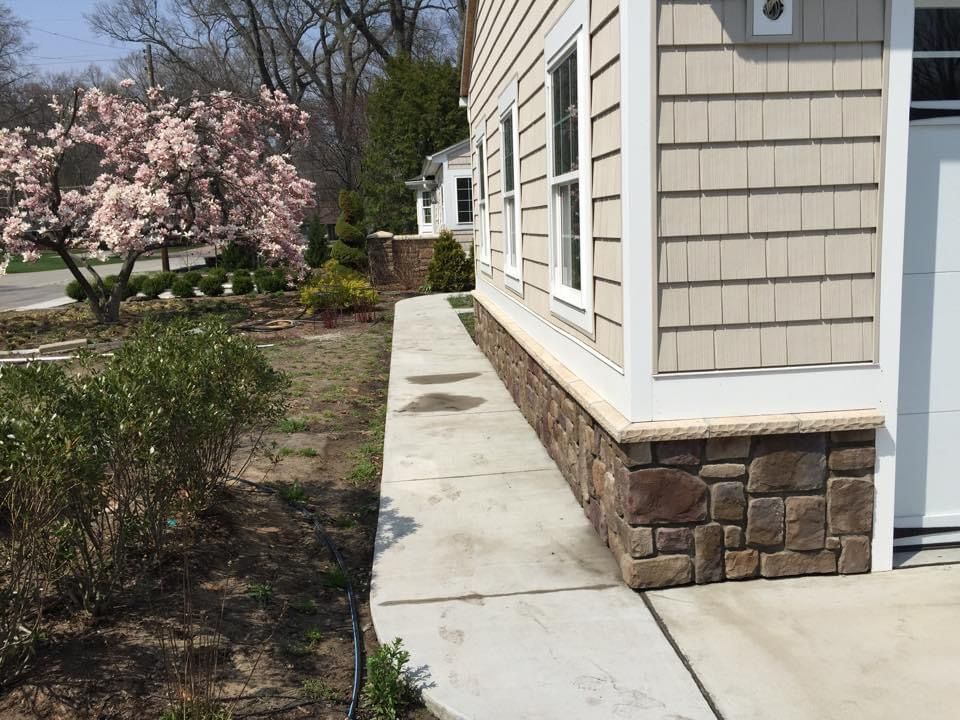 A house with a stone walkway leading to it