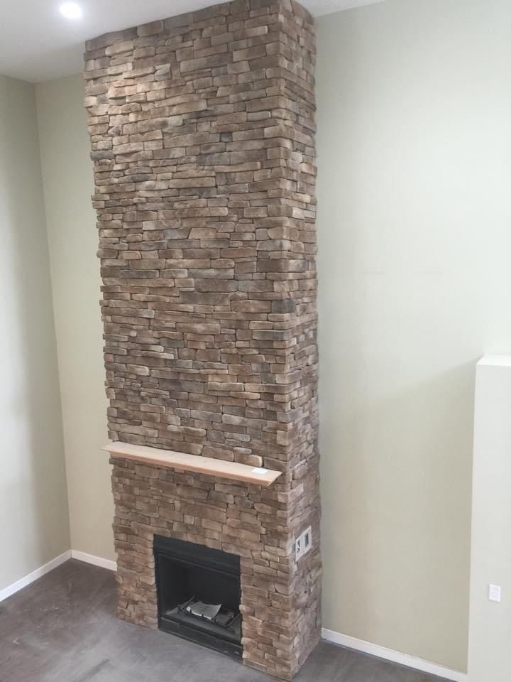 There is a fireplace in the corner of the room.