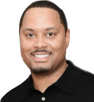 A smiling Black man in a black polo shirt, with a slight goatee and brown eyes.