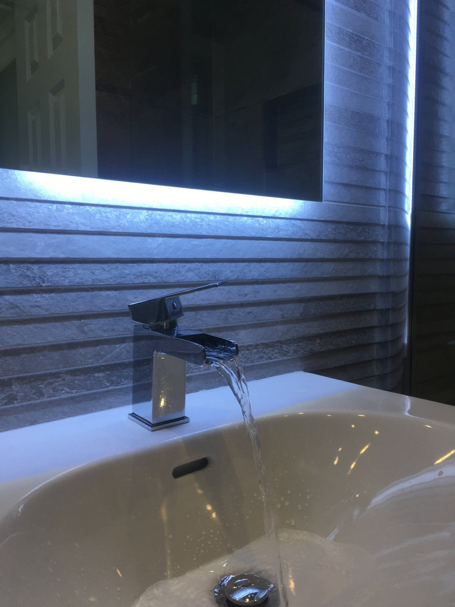 Waterfall tap, LED bathroom mirror