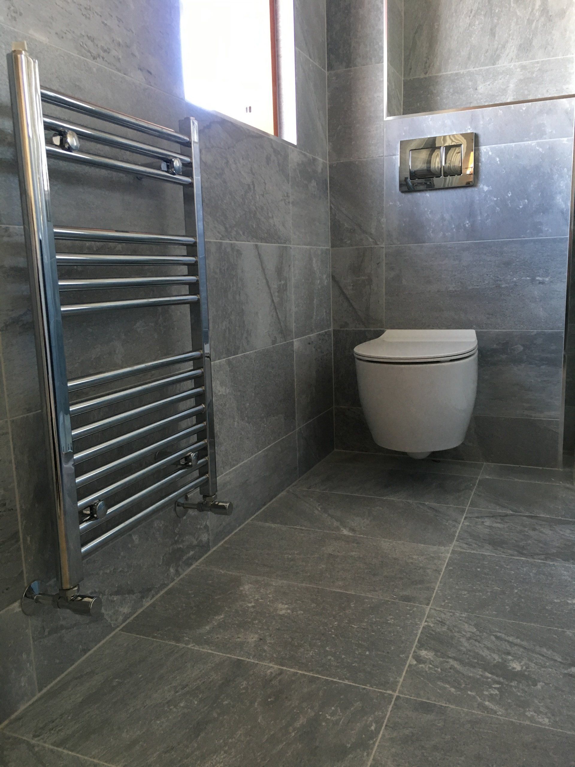 Wall hung WC, grey tiles, bathroom renovation Dublin