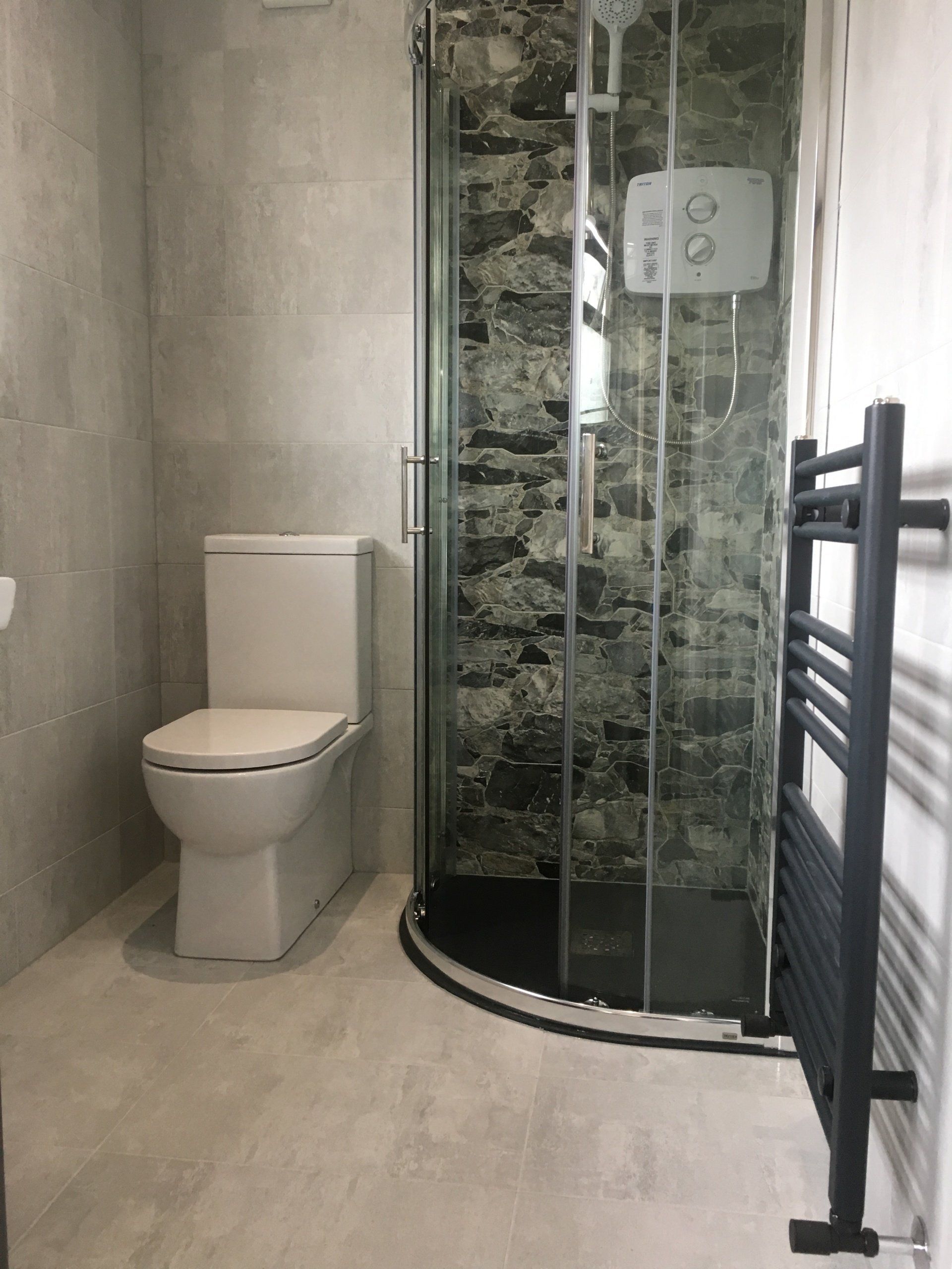 Bathroom renovation, quadrant shower, decor tiles, anthracite heated towel rail