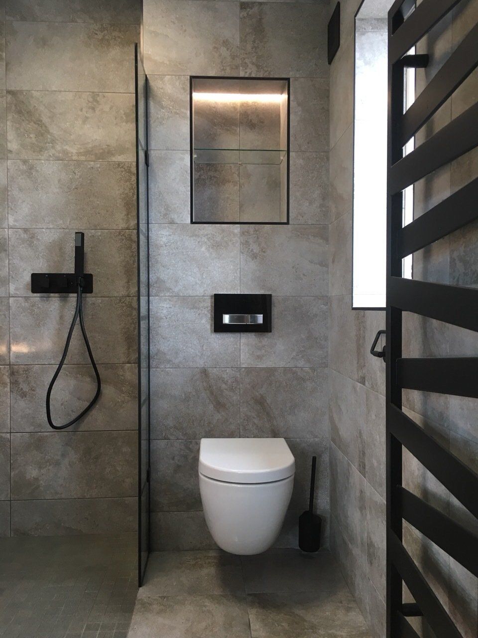 Black heated towel rail, modern bathroom