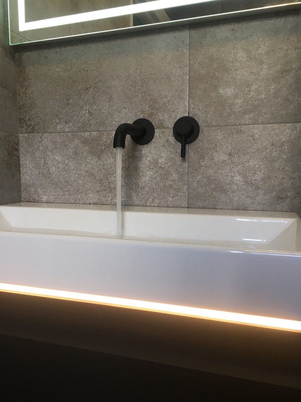 Grey tiles, black taps, wall mounted taps, vanity unit, bathroom renovation