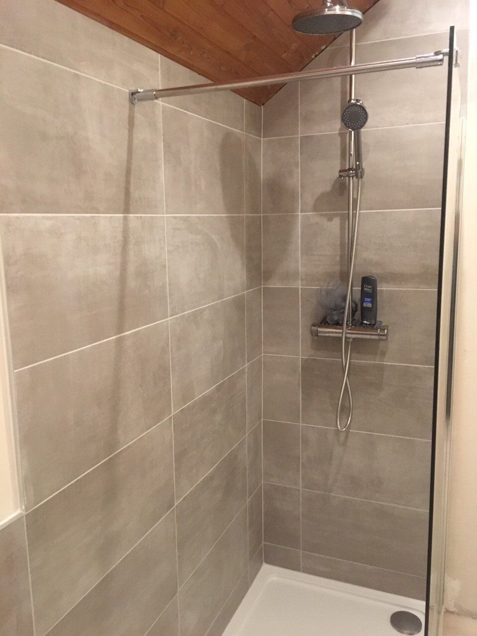 Bathroom grey tiles wooden ceiling walk in shower thermostatic rainwater shower kit with handset