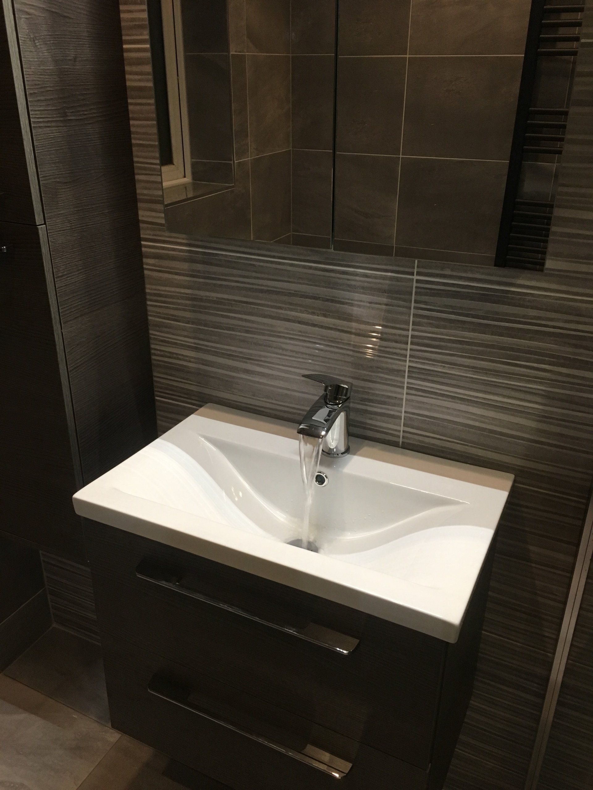 Dark wood wall hung bathroom vanity unit and mirror cabinet