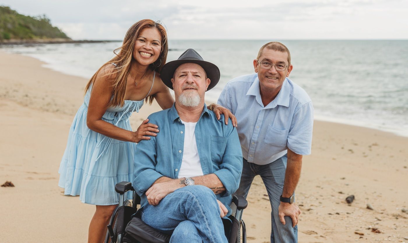 A Nurse is Standing Next to an Elderly Woman in a Wheelchair — Collis Care In Dundowran, QLD
