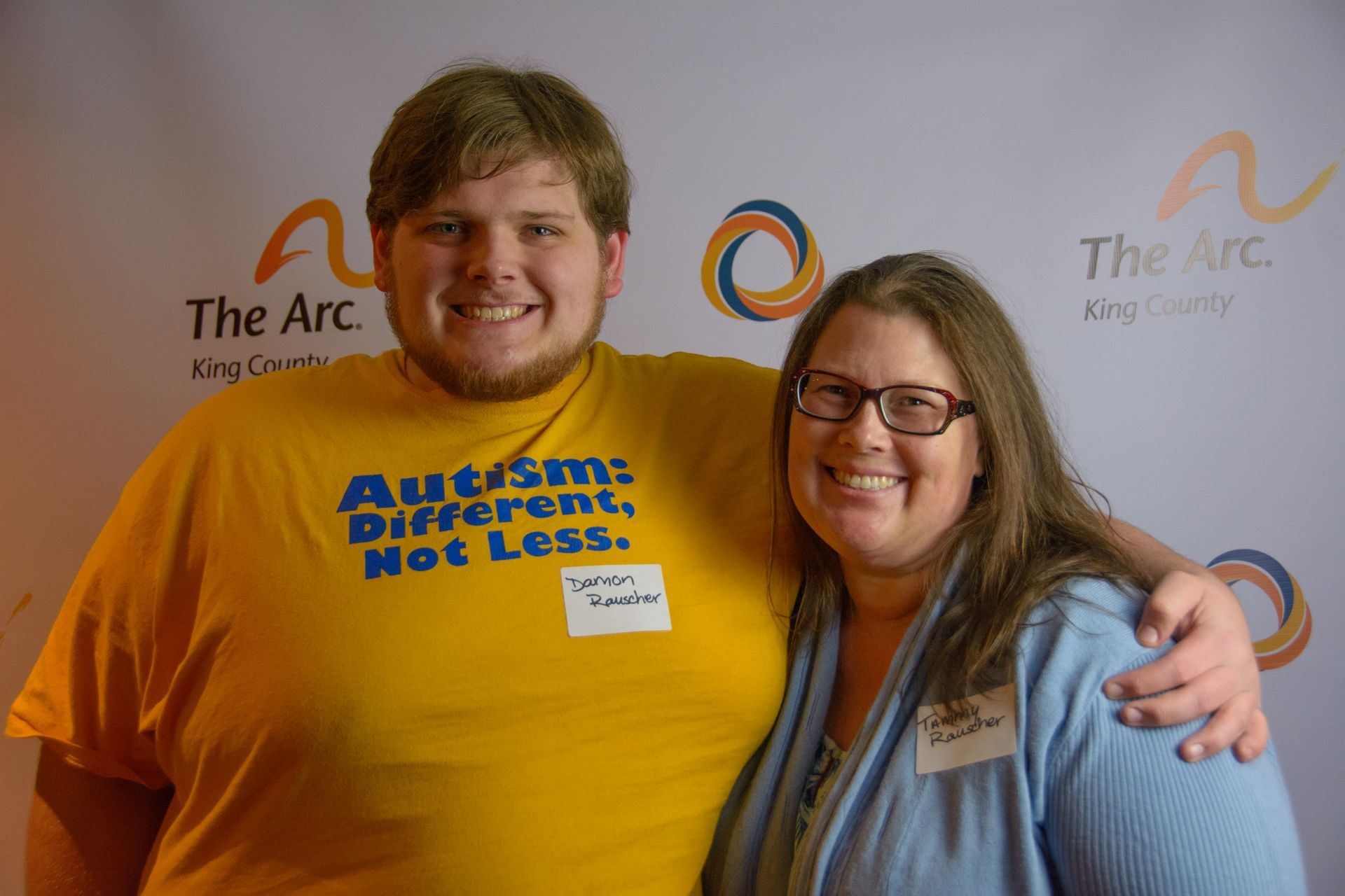 A man and a woman smiling togther.