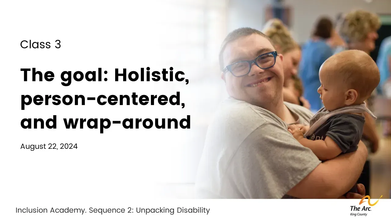 Man holding a baby, smiling. Text reads: 