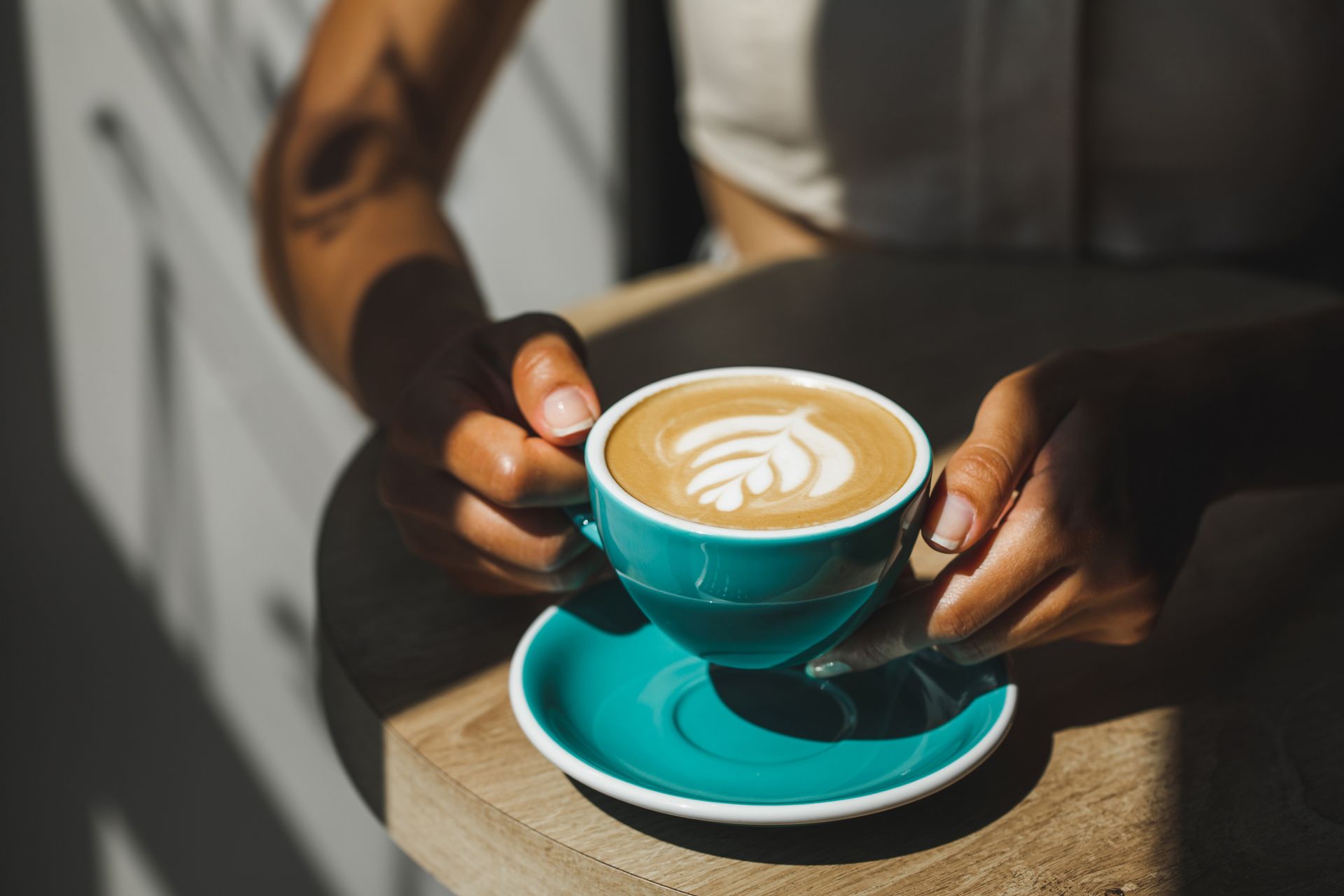 Holding Cup of Fresh Cappuccino — Brooklyn, NY — Drip Beverage Lounge