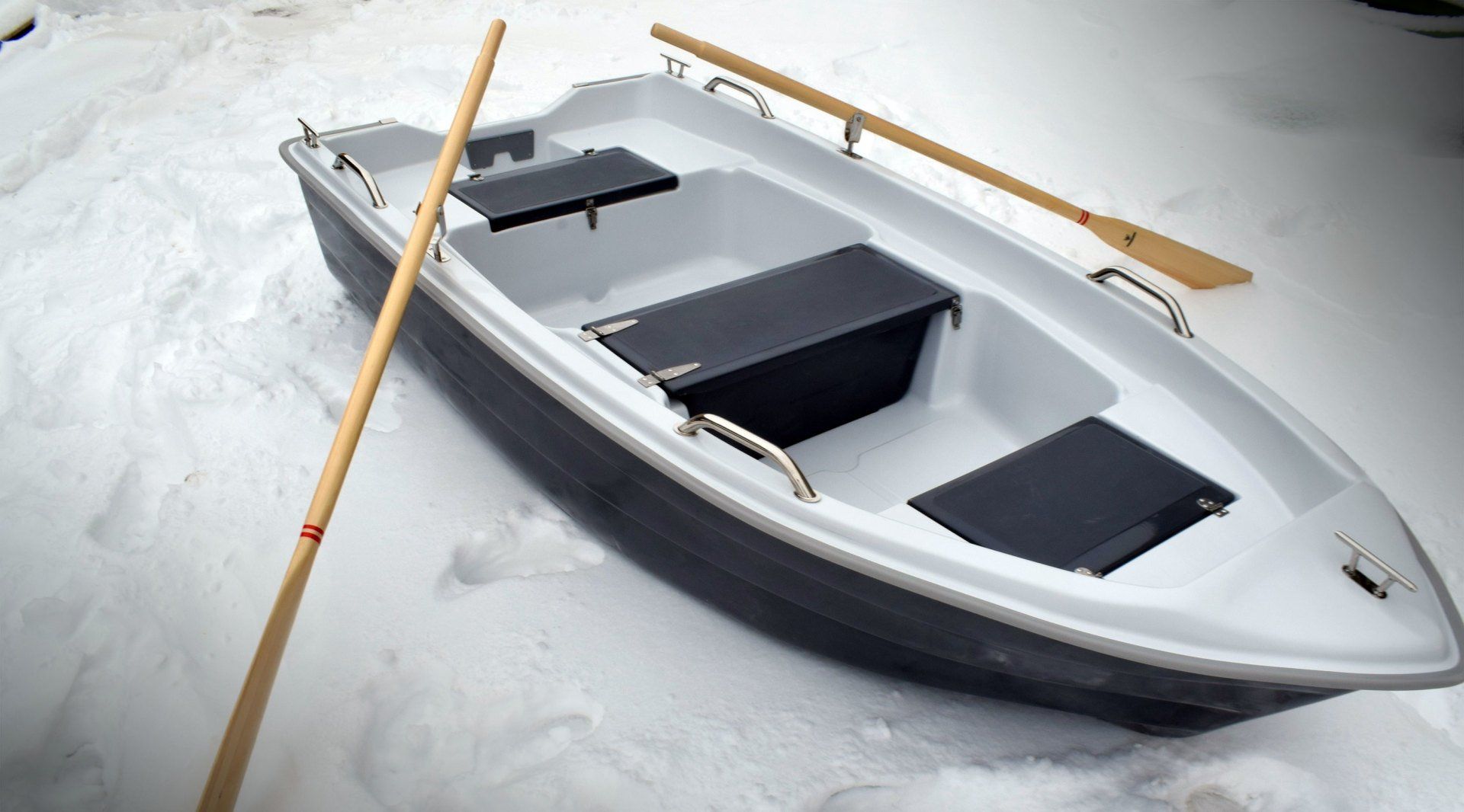 fiberglass boat with oars