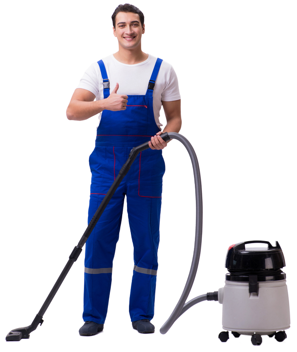 Man in blue overalls giving a thumbs up, vacuuming a floor with a gray vacuum cleaner.