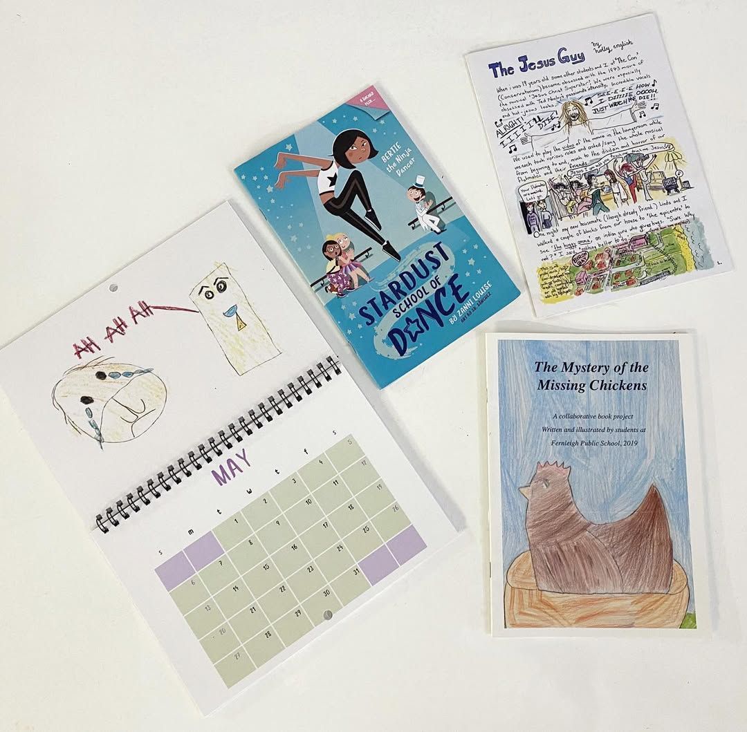 Books, a Calendar, and A Drawing Are Spread Out — Digi Print Pro in Grafton, NSW
