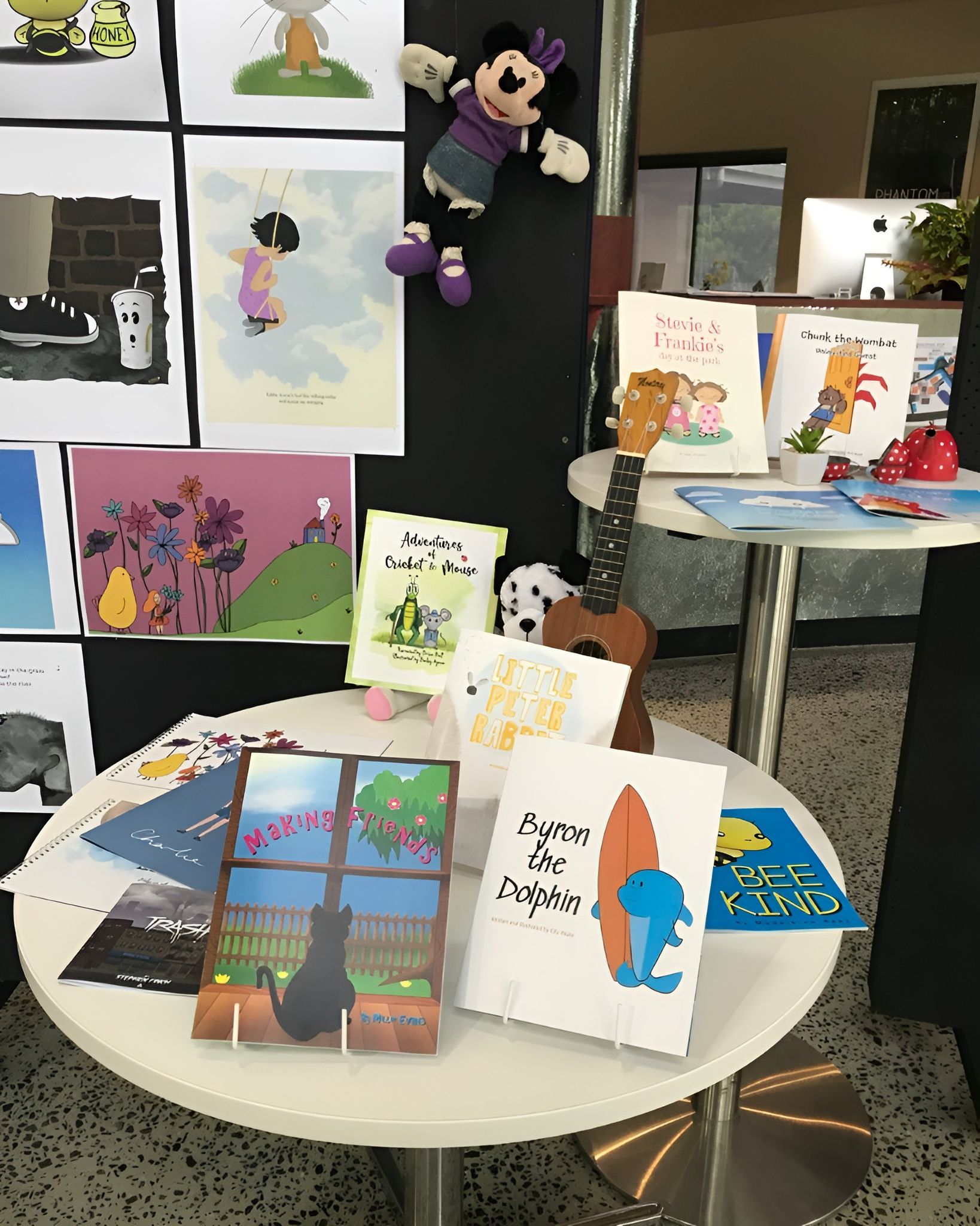 Table with Children's Books, a Ukulele, and A Minnie Mouse Doll on Display — Digi Print Pro in Bangalow, NSW