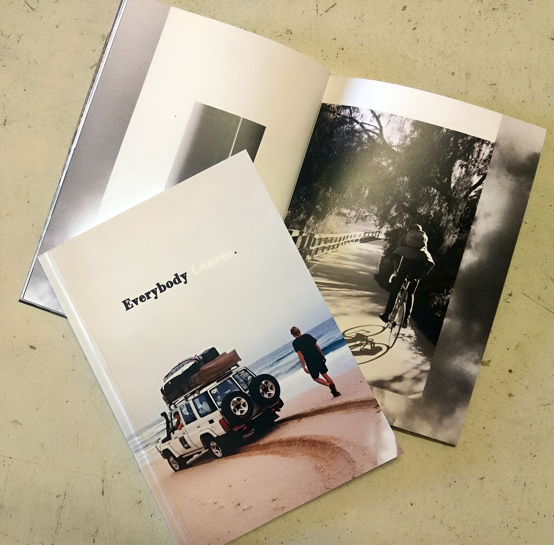 A Book with A Photo of A Car on The Beach, Opened to Pages with Pictures — Digi Print Pro in Mullumbimby, NSW