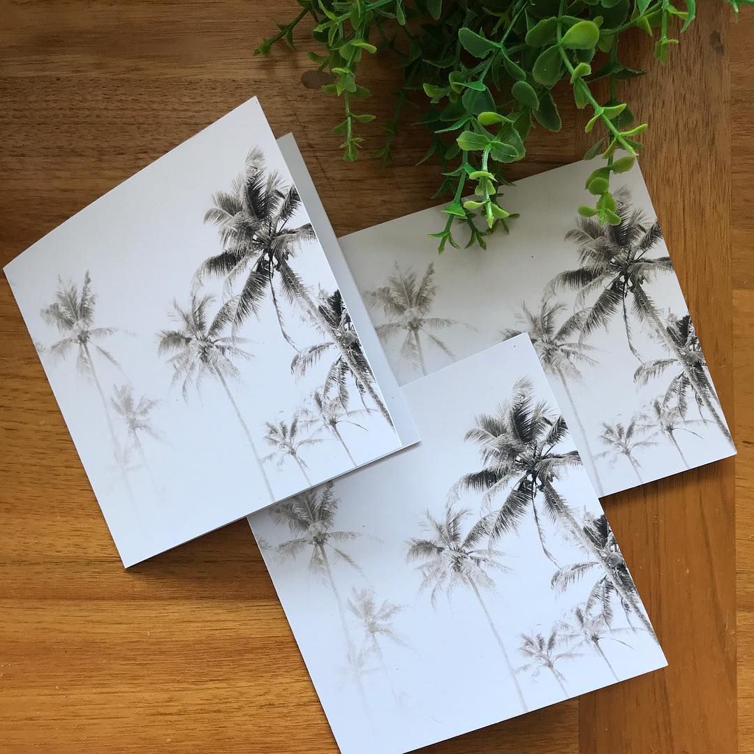 Palm Tree Cards on A Wooden Table, with Green Plant in Background — Digi Print Pro in Grafton, NSW