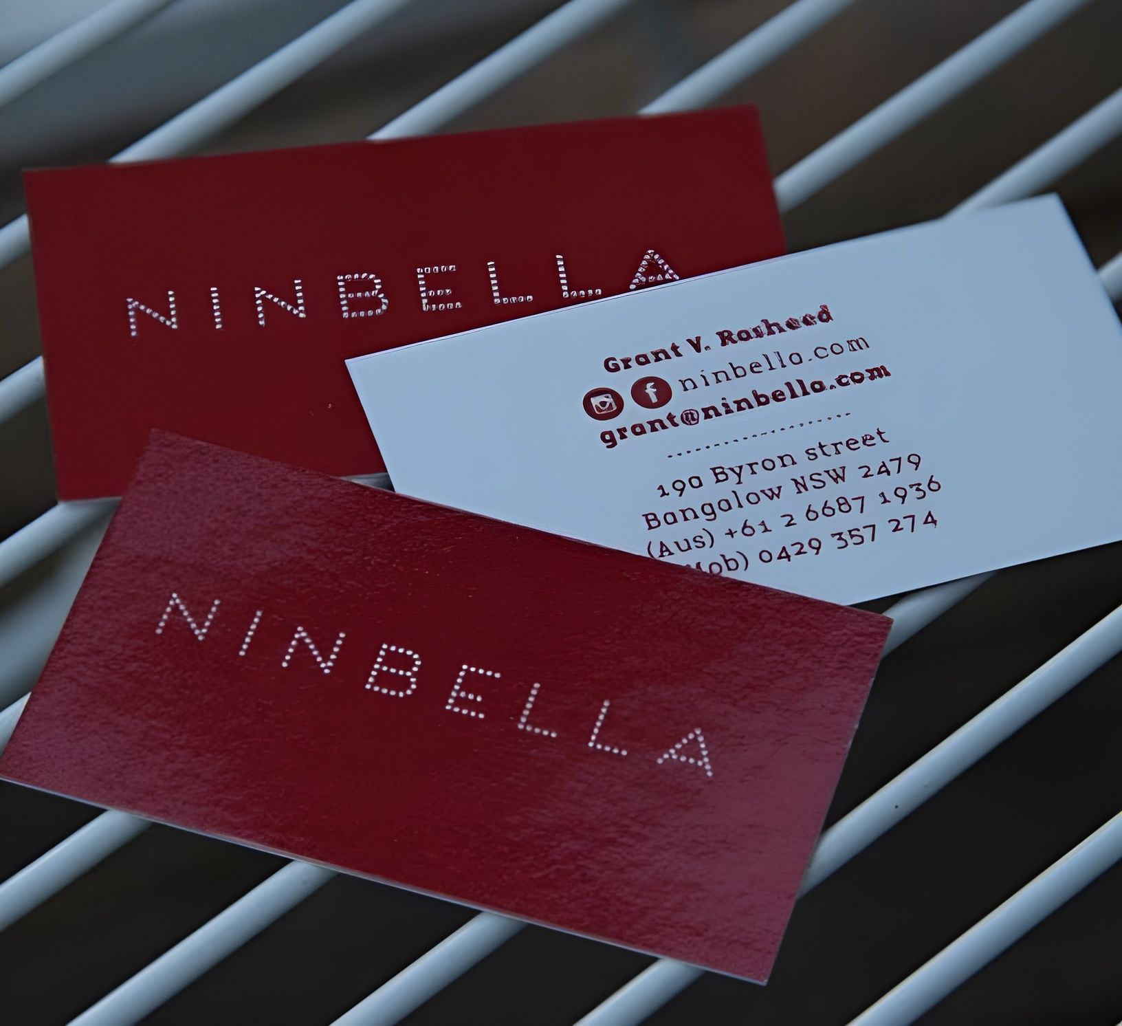 Two Glossy Red and One White Business Cards with Ninbella and Contact Info — Digi Print Pro in Ballina, NSW