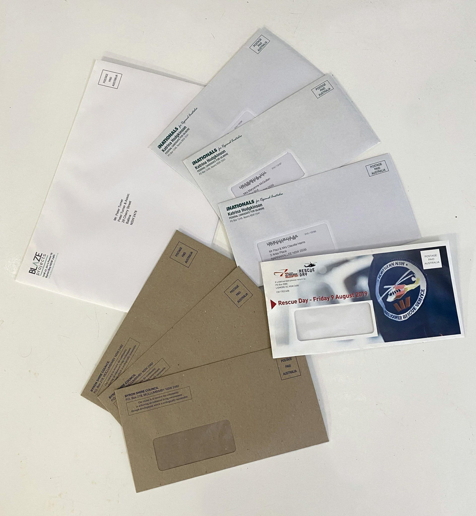 Envelopes, White, Brown, and Printed, Fanned out On a White Surface — Digi Print Pro in Bangalow, NSW