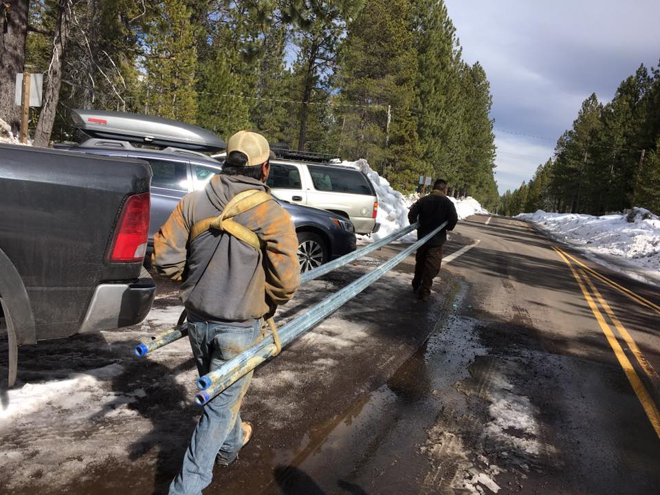 Workers Carrying Pump — Terrebonne, OR — Abbas Well Drilling & Pump Service