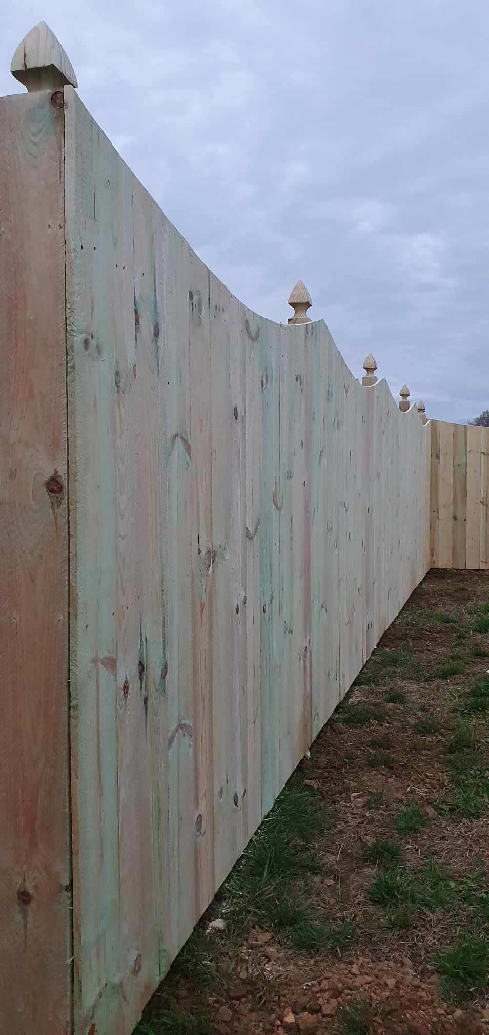 A wooden fence is sitting in the middle of a grassy field. Clarksville, TN
