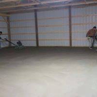 Indoor Garage Construction — Two Man Flatting the Concrete Floor  in Louisville, KY