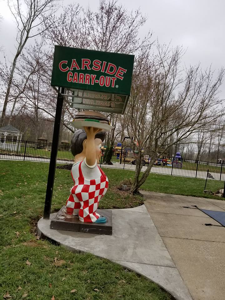 Concrete Statue — Statue of Boy Holding Burger in Louisville, KY