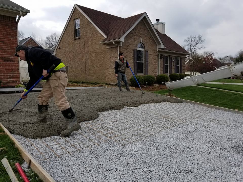 Pathway Widening — Construction Worker Spreading Cement Flooring 1 in Louisville, KY