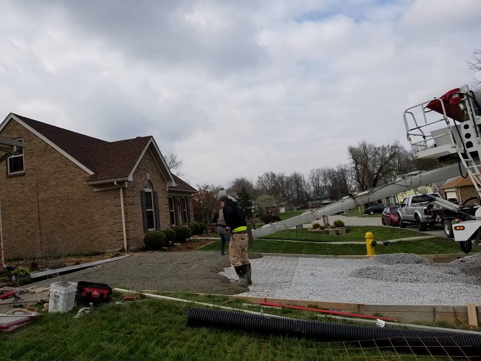 Concrete Pathway Widening — Construction Worker Spreading Cement Flooring 2 in Louisville, KY