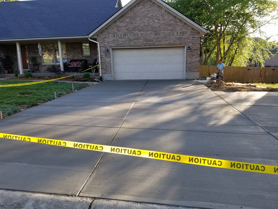 Garage Complete Renovation — Garage Pathway with Yellow Tape for Caution 2 in Louisville, KY