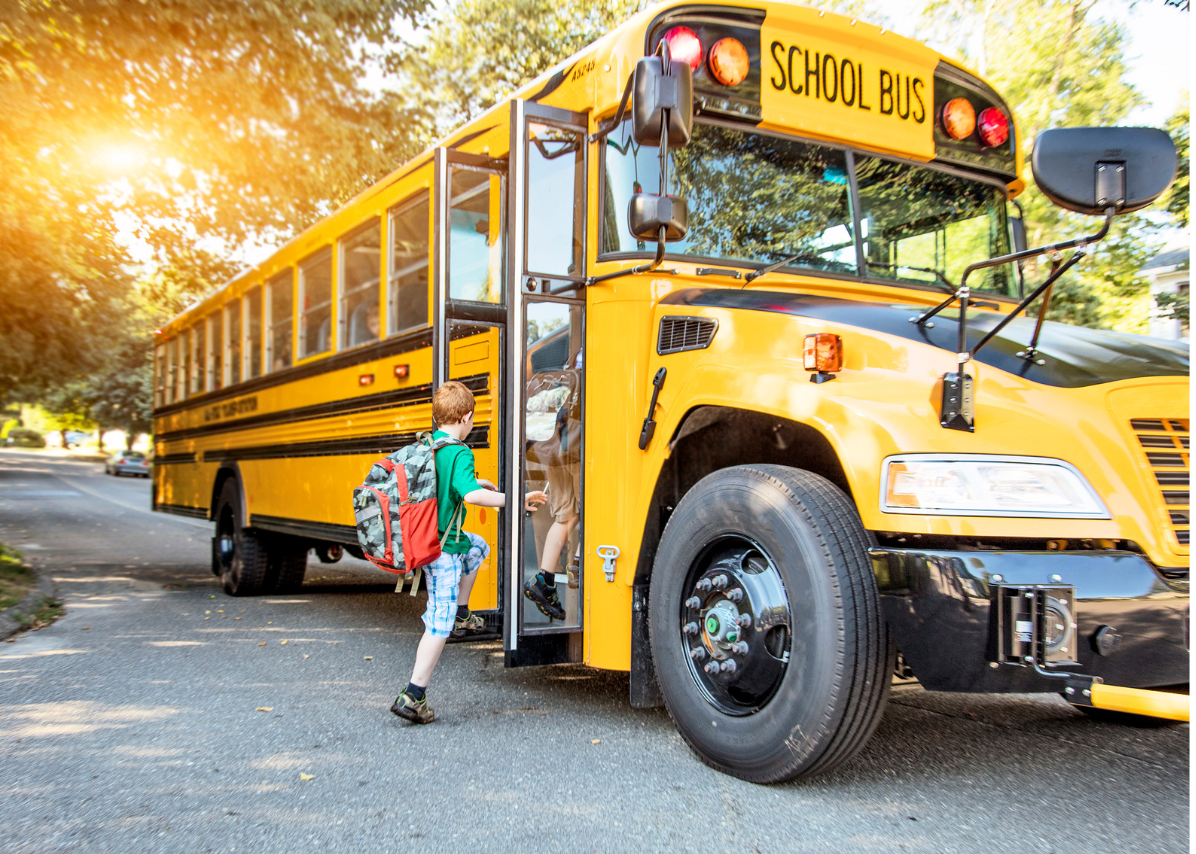 Student boarding a school bus.