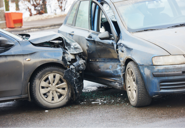 Two cars are involved in a car accident on the road.