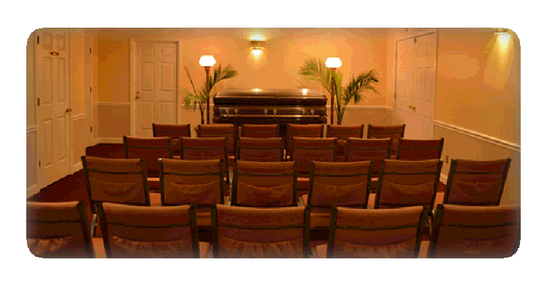 Funeral home chapel with a casket and seating.